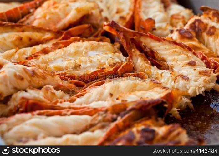 Fried lobsters in a pan on a plate
