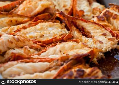 Fried lobsters in a pan on a plate