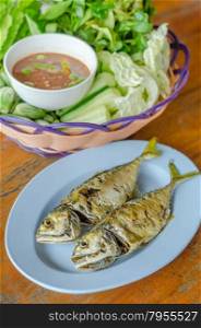 fried mackerel. fried mackerel with fresh vegetables and spicy sauce