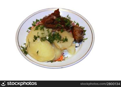 Fried meat and bolied potatoes and dill over isolated