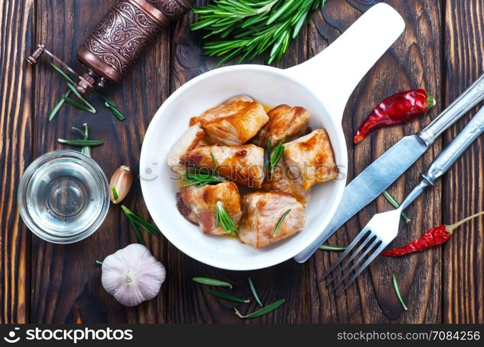 fried meat in bowl and on a table