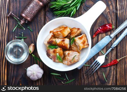 fried meat in bowl and on a table