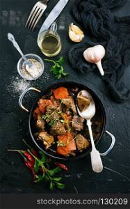 fried meat with carrot and onion, meat with vegetables