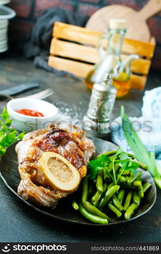 fried meat with spice and fresh greens