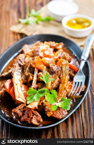 fried meat with spice on the pan