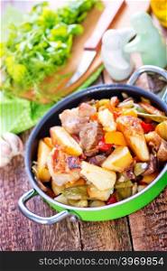 fried meat with vegetables in the bowl