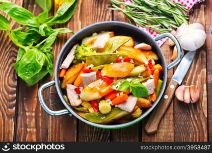 fried meat with vegetables wirh spice and salt