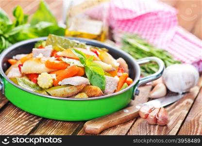 fried meat with vegetables wirh spice and salt