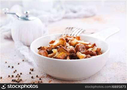 fried mushroom in bowl and on a table