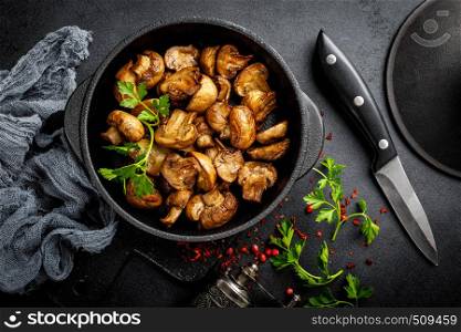 Fried mushrooms, champignons in pan