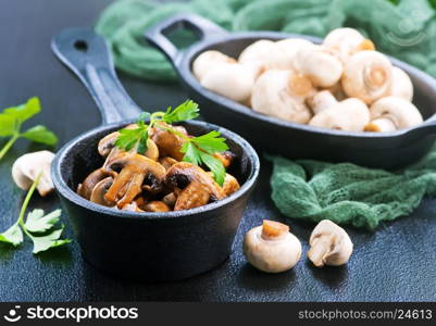 fried mushrooms in bowl and on a table