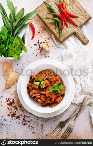 fried mushrooms with vegetables and tomato sauce