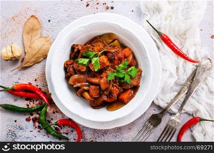 fried mushrooms with vegetables and tomato sauce