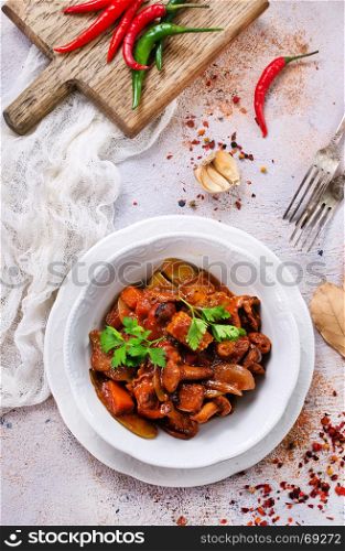 fried mushrooms with vegetables and tomato sauce