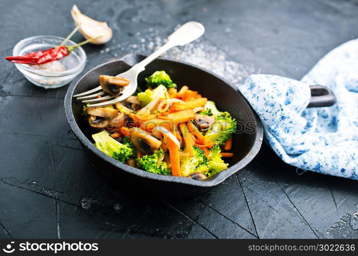 fried mushrooms with vegetables, fried vegetables in pan