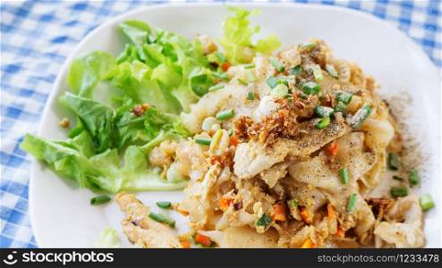 Fried noodles with chicken, (Thai food).
