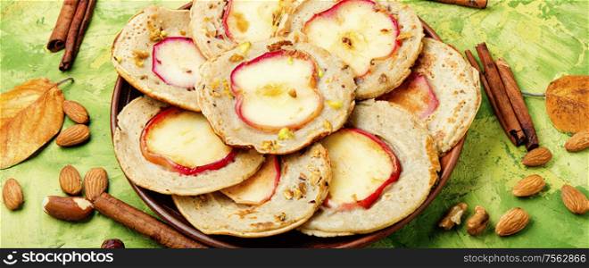 Fried pancakes filled with ripe autumn apples.Autumn dessert.. Fried pancakes with apples