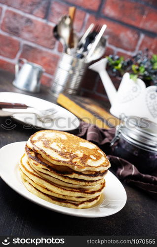 fried pancakes on white plate on a table