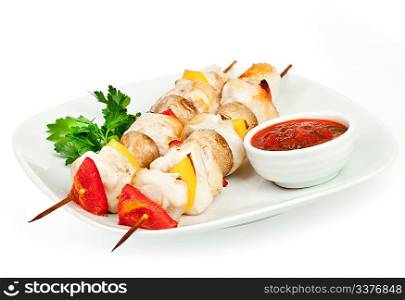 Fried pieces of a hen with sauce on a white background