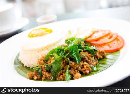 fried pork basil Rice with egg tomato and cucumber