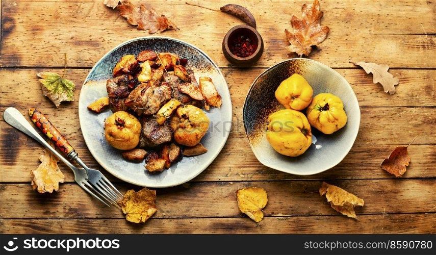 Fried pork meat with autumn quince.. Baked meat cuts with quince