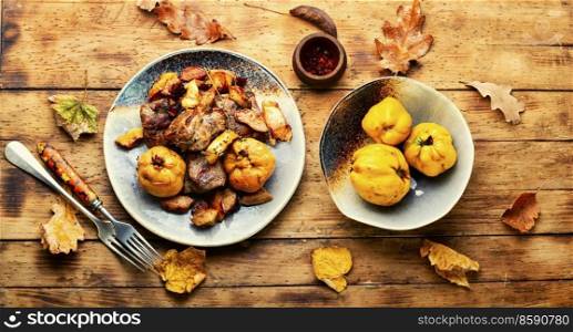 Fried pork meat with autumn quince.. Baked meat cuts with quince