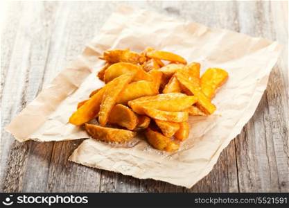 fried potato on wooden table
