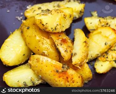 fried potato slices on ceramic plate close up