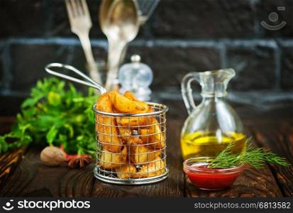 fried potato with salt and spice on a table