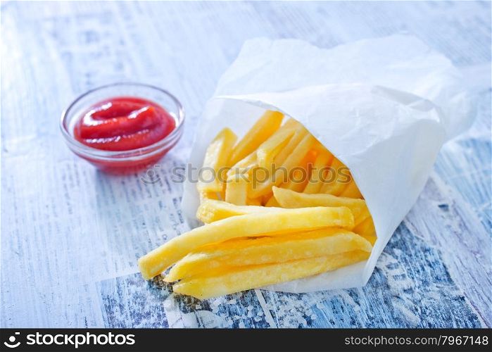 fried potato with sauce and on a table