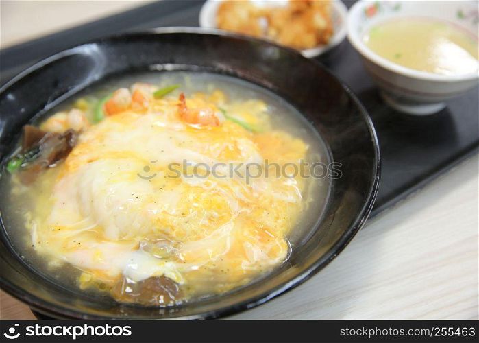 fried rice , Japanese fried rice with egg and seafood with soup on top