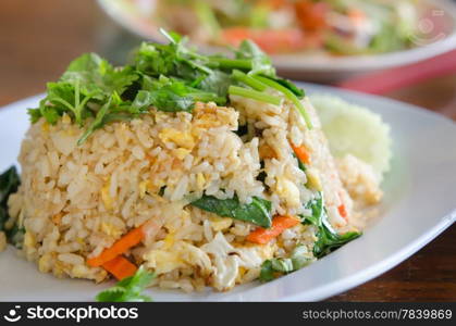 fried rice with eggs and mix vegetable on white dish