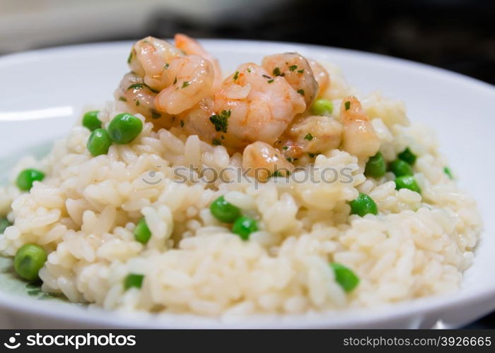 fried rice with shrimps and vegetables, closeup dish