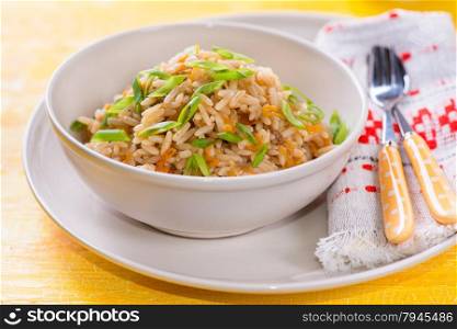Fried rice with vegetables and green onion, closeup