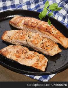 Fried Salmon Fillets In A Iron Platter