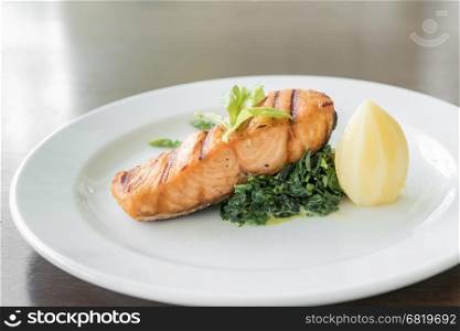 fried Salmon Steak with spinach