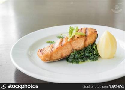 Fried Salmon Steak with spinach