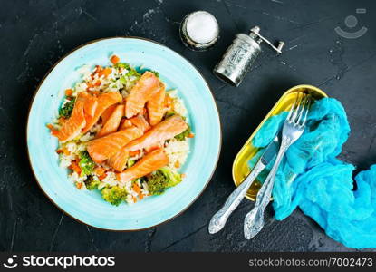 fried salmon with boiled rice and broccoli