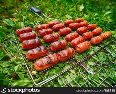 Fried sausages at the stake