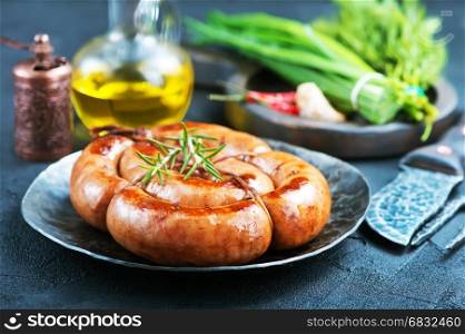 fried sausages with salt and spice on a table