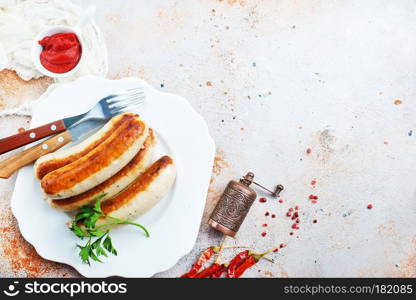 fried sausages with sauce on a table