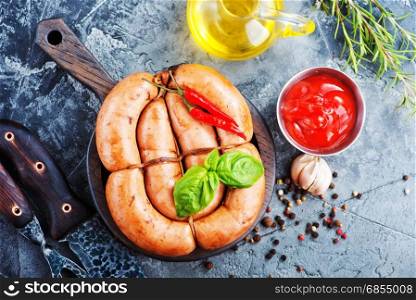 fried sausages with sauce on a table