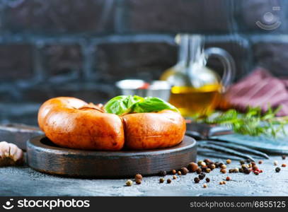 fried sausages with sauce on a table