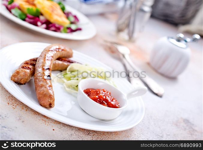fried sausages with sauce on the plate