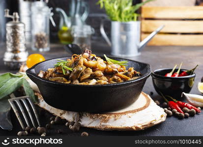 fried seafood in pan on a table