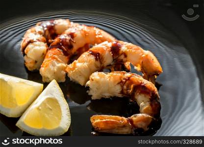 Fried shrimps on the black background