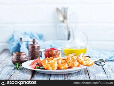 fried shrims with tomato sauce and lemon