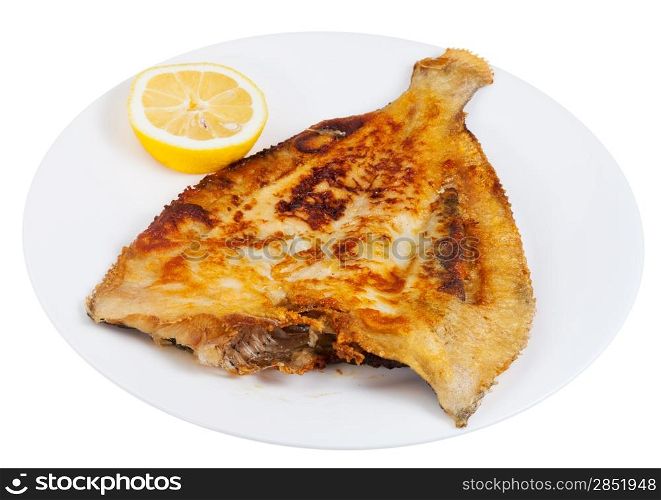 fried sole fish with lemon on white plate isolated on white background
