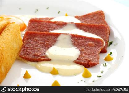 Fried spam with a delicious cheese sauce and toast fingers.