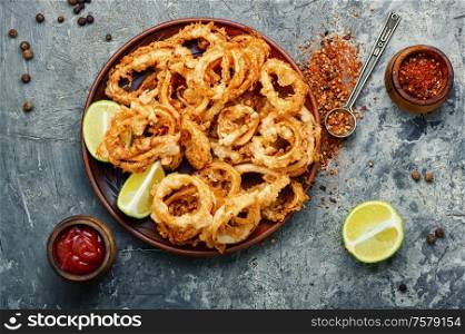 Fried squid or calamari rings with sauce.Fast food. Crispy fried squid rings